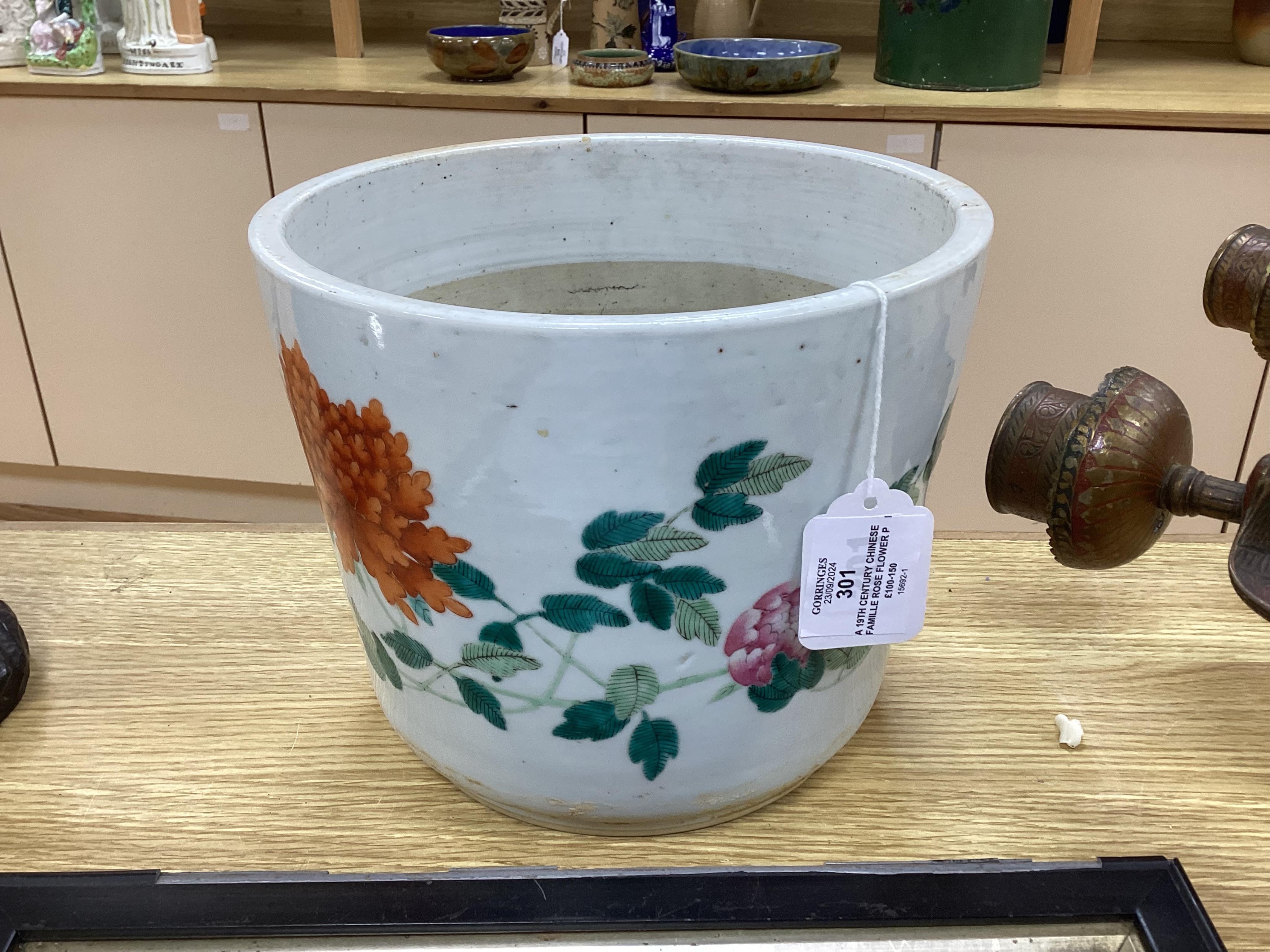 A 19th century Chinese famille rose flower pot, 19.5cm high. Condition - hole drilled to base.